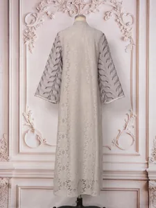 Back view of elegant long-sleeved lace dress with sequins leaf embroidery details