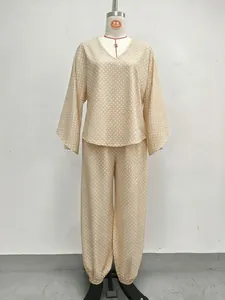 Retro polka dot loungewear set detail showing batwing sleeve top and gathered pants