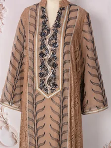 Detailed view of ethnic style mesh dress with intricate black sequin and bead embroidery.