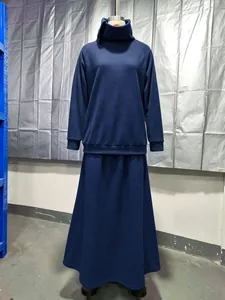 Minimalist navy blue two-piece set featuring a high neck sweatshirt and long skirt