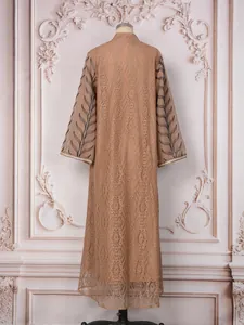 Back view of tan ethnic maxi dress with sequin leaf embroidery and lace texture