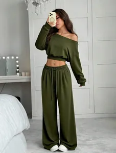 Detailed view of women's olive green off-shoulder cropped sweatshirt and wide-leg pants set