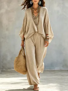 Full view of bohemian polka dot batwing sleeve top and matching pants set on model