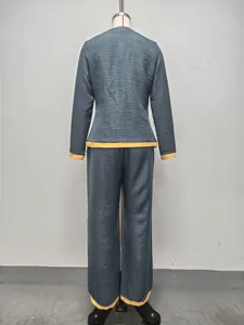Back view of women's textured blue-grey and yellow wide-leg pant set shown on mannequin