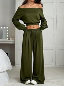 Full view of olive green off-shoulder cropped sweatshirt and wide-leg trousers set.
