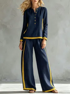 Stylish navy and yellow contrast two-piece set with wide-leg pants and button top