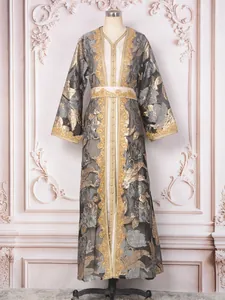 Elegant grey and gold heavy beaded long dress evening gown on mannequin for luxury parties