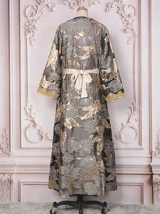 Elegant grey and gold floral brocade long dress with heavy beadwork detail, back view on mannequin.