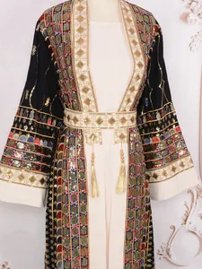 Macro view of elegant ceremonial dress with heavy sequin embroidery and gold tassels