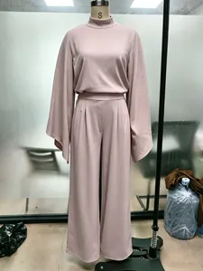 Two-piece mauve lounge set with wide-sleeve top and high-waist pants on a mannequin.