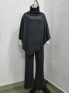 Detailed view of women's two-piece charcoal grey fleece poncho top and wide-leg pants set
