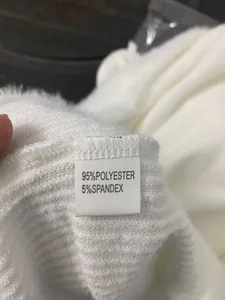 Close-up detail shot of clothing wash tag showing 95% polyester and 5% spandex blend