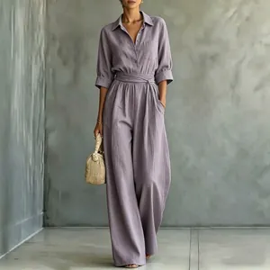 Detail view of mauve wide-leg shirt jumpsuit with mid-sleeves and waist tie