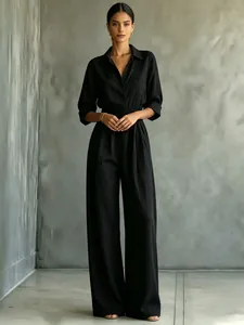 Full view of the elegant black mid-sleeve shirt jumpsuit featuring a wide-leg design.