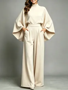 Elegant beige half-high neck wide-leg trouser suit with stylish flared cape sleeves