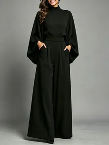 Sophisticated black two-piece set featuring half-high neck and loose wide-leg trousers.