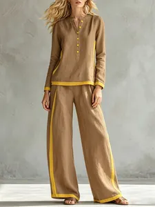 Elegant two-piece linen-look set featuring yellow contrast trim and wide-leg trousers