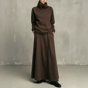Elegant minimalist dark brown turtleneck sweatshirt and long maxi skirt two-piece set