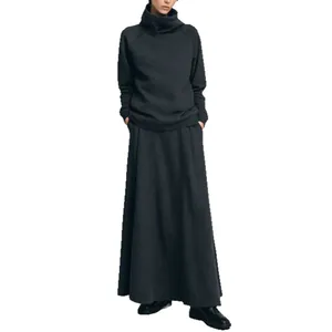 Minimalist dark grey two-piece set featuring a turtleneck sweatshirt and a long maxi skirt