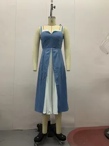 Detail view of a blue and white patchwork sleeveless midi dress with a cinched waist