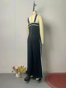 Back view detail of a chic black two-piece wide-leg set with white contrast trim