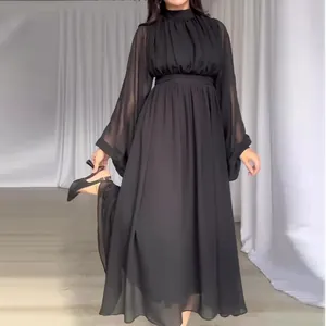 Elegant black maxi dress featuring sheer long mesh sleeves and a high neckline.