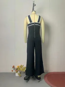 Detailed back view of a black summer two-piece set featuring white contrast stripes
