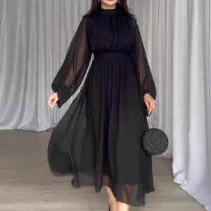 Detailed view of an elegant black mesh spliced midi dress with sheer long sleeves
