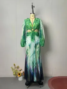 Detailed view of the tropical green floral print maxi dress featuring waist cut-outs