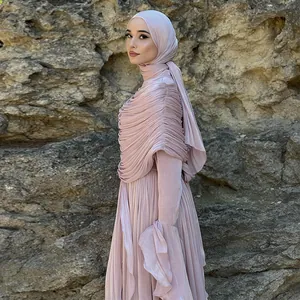 Detail showing the elegant pleated fabric and ruffled sleeve of the dusty pink hijab dress.