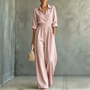 Elegant pink mid-sleeve shirt jumpsuit with tie waist and wide legs detail view