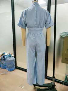 Back detail of a light blue short-sleeved wide-leg jumpsuit for women with high waist
