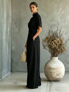 Full view of an elegant black half-high neck wide-leg jumpsuit for summer style