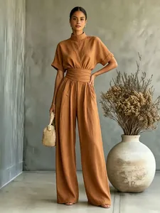 Detail view of stylish terracotta high-neck wide-leg jumpsuit for a chic summer look