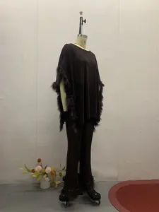 Elegant black sequined two-piece set with tunic top and pants featuring feathery fringe