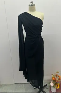 Front view of elegant black one-shoulder ruched dress with flowing drape and side slit