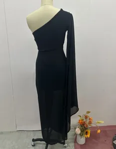 Detailed rear view of black one-shoulder dress with elegant long sheer sleeve drape