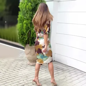 Back view of stylish V-neck high-waisted sheath dress with abstract colorful prints