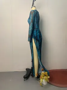 Side view detail of long-sleeved resort cardigan featuring a high slit and blue feather pattern