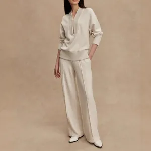 Full view of elegant cream knit lounge set with zipper pullover and wide-leg pants