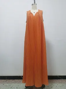 Elegant orange sleeveless pleated maxi dress with V-neckline shown on a mannequin