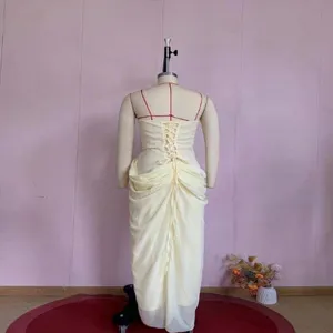 Elegant yellow strapless ruched maxi dress featuring corset lacing shown from back view