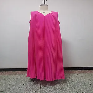 Detail view of a bright pink sleeveless pleated plus size maxi dress on a mannequin.