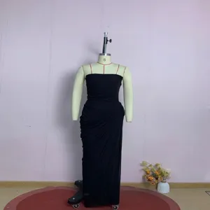 Detailed view of black strapless evening dress with elegant pleated slit on mannequin