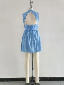 Back view of blue striped sleeveless mini dress with scalloped back cutout detail