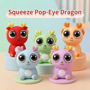 Set of five colorful popping eye dragon squeeze toys for stress relief and sensory play