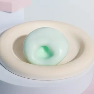 Detailopname van mintgroen TPR squishy speelgoed met zachte mochi-textuur.