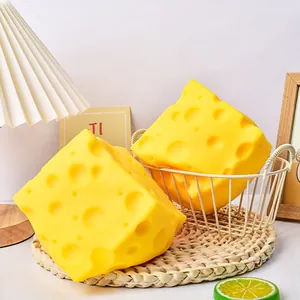 Detailed view of large realistic cheese squeeze toy with porous texture and bright yellow color