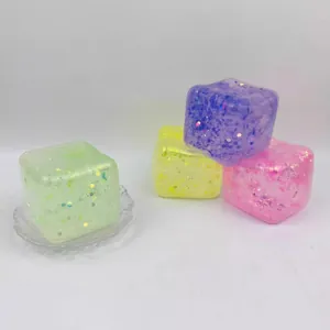 Detailed view of glitter-filled translucent squishy ice cube toys in various pastel colors.