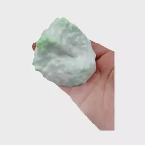 Soft handmade squishy stress relief ball toy with textured white and green ice skin surface